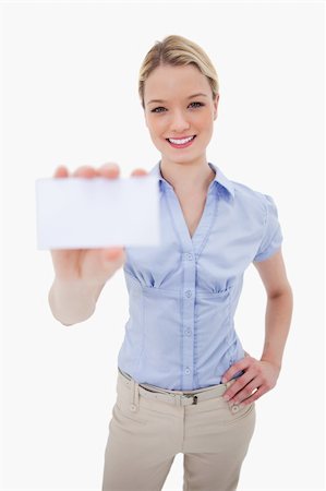 simsearch:400-05368656,k - Woman holding blank business card against a white background Stockbilder - Microstock & Abonnement, Bildnummer: 400-05898813