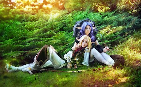 Elf boy and elf girl stayng near the tree Stockbilder - Microstock & Abonnement, Bildnummer: 400-05898862