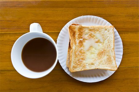 simsearch:400-06142439,k - Coffee cup and Pour the milk toast on the wooden table Stock Photo - Budget Royalty-Free & Subscription, Code: 400-05899154
