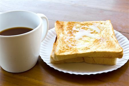 simsearch:400-07678720,k - Coffee cup and Pour the milk toast on the wooden table Stock Photo - Budget Royalty-Free & Subscription, Code: 400-05899156