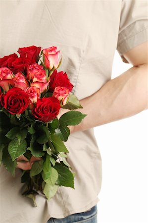 Man holding a bouquet of roses behind his back Stock Photo - Budget Royalty-Free & Subscription, Code: 400-05899205
