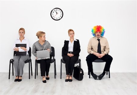 There's one in every crowd - clown among job candidates waiting Stock Photo - Budget Royalty-Free & Subscription, Code: 400-05899237