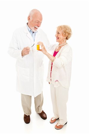 patient counselling in pharmacy - Senior woman questions her trusted pharmacist about medication.  Full body isolated on white. Stock Photo - Budget Royalty-Free & Subscription, Code: 400-05899498