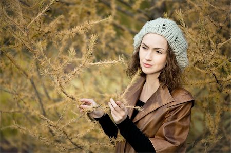 young girl in autumn forest standing near the tree Stock Photo - Budget Royalty-Free & Subscription, Code: 400-05899605