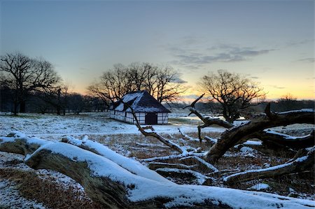 simsearch:400-08108630,k - Winter landscape with a hut in the background Photographie de stock - Aubaine LD & Abonnement, Code: 400-05899912