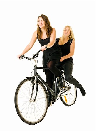 Two women on a bicycle isolated on white background Stock Photo - Budget Royalty-Free & Subscription, Code: 400-05890519