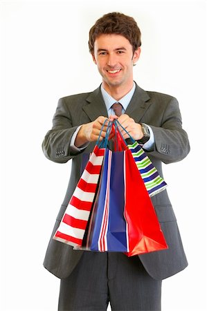 Portrait of smiling modern businessman with shopping bags Stock Photo - Budget Royalty-Free & Subscription, Code: 400-05890634