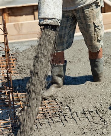 poured concrete construction - Pouring concrete - detail of man directing the pump Stock Photo - Budget Royalty-Free & Subscription, Code: 400-05890757