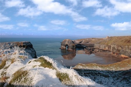 snow covered view of beach cliffs and the virgin rock in ballybunion county kerry ireland Stock Photo - Budget Royalty-Free & Subscription, Code: 400-05890784