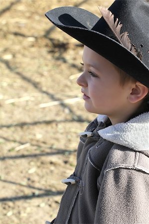 Young cowboy wearing a hat and fleece jacket Photographie de stock - Aubaine LD & Abonnement, Code: 400-05890827