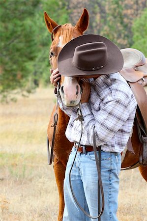 ranchers - Cowboy with his horse in the field Stock Photo - Budget Royalty-Free & Subscription, Code: 400-05890872