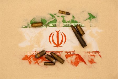 Iran flag covered in sand with different ammunition scatter on it Stock Photo - Budget Royalty-Free & Subscription, Code: 400-05890892