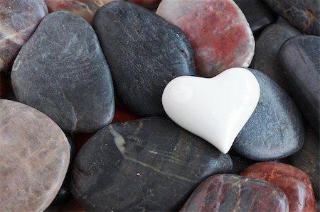 White heart heart surrounded by natural stones Stock Photo - Budget Royalty-Free & Subscription, Code: 400-05890926