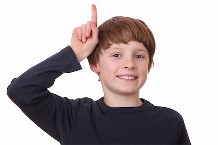 simsearch:400-04622920,k - Portrait of a smart boy pointing upwarde Fotografie stock - Microstock e Abbonamento, Codice: 400-05891830