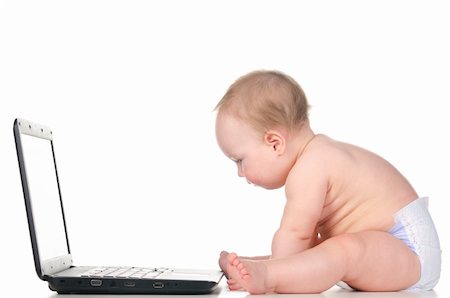 little baby is working on laptop, isolated on white background Stock Photo - Budget Royalty-Free & Subscription, Code: 400-05891854