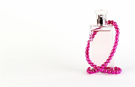 close up bottle of perfume isolated on white Foto de stock - Super Valor sin royalties y Suscripción, Código: 400-05892190