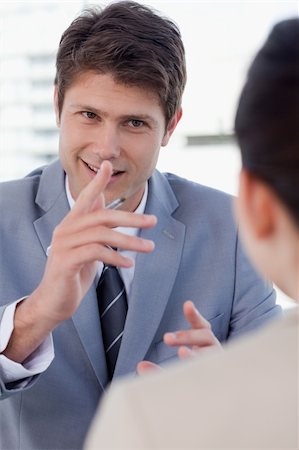 simsearch:400-04187120,k - Portrait of a handsome manager interviewing a female applicant in his office Stock Photo - Budget Royalty-Free & Subscription, Code: 400-05892371