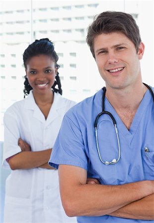 simsearch:6109-06006535,k - Portrait of happy doctors standing up in an office Stockbilder - Microstock & Abonnement, Bildnummer: 400-05892429