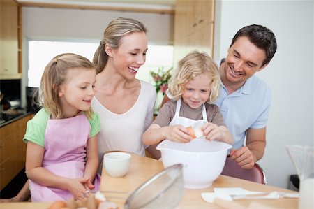 Family preparing cookies together Stock Photo - Budget Royalty-Free & Subscription, Code: 400-05893074