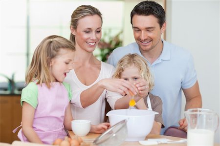 family prepare cake - Family making dough together Stock Photo - Budget Royalty-Free & Subscription, Code: 400-05893071