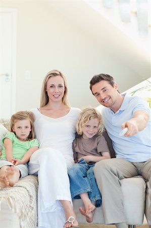 simsearch:6109-06003128,k - Family enjoying a movie together Stock Photo - Budget Royalty-Free & Subscription, Code: 400-05893109