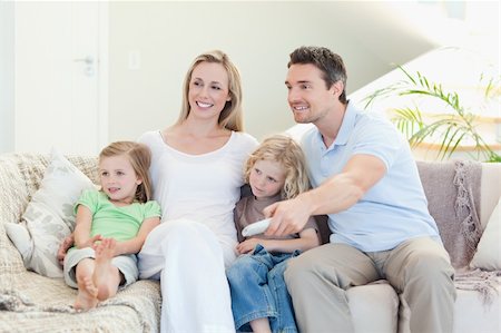 simsearch:6109-06005142,k - Happy family enjoying a movie together Stock Photo - Budget Royalty-Free & Subscription, Code: 400-05893110