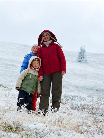 Family (mother with children) walk and play on autumn  mountain plateau with first winter snow Stock Photo - Budget Royalty-Free & Subscription, Code: 400-05904336