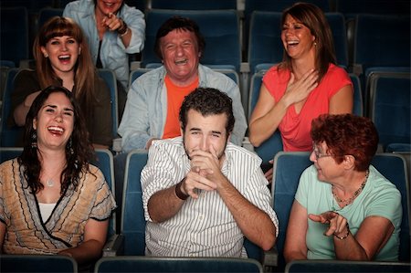 photo of theatre audience laughing - Group of seven audience watching movie laugh in theater Stock Photo - Budget Royalty-Free & Subscription, Code: 400-05904535