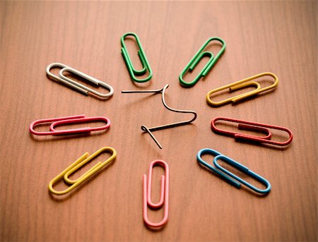 simsearch:400-06920356,k - Paper clips on wood background illustrating a unique concept Stock Photo - Budget Royalty-Free & Subscription, Code: 400-05905347