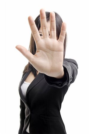 symbol present - Serious business woman making stop sign over white background. Focus on hand Stock Photo - Budget Royalty-Free & Subscription, Code: 400-05905693