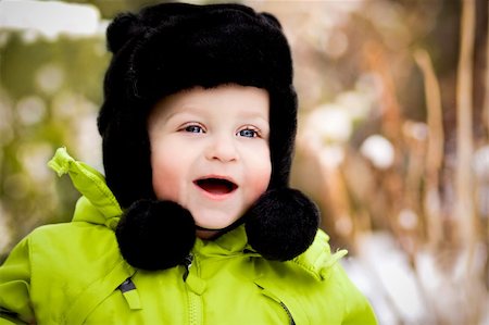 snow sun portrait - Happy smiling baby in winter Stock Photo - Budget Royalty-Free & Subscription, Code: 400-05905950