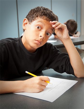 frustrated school students in classroom - Student looks worried by a surprise quiz in class. Stock Photo - Budget Royalty-Free & Subscription, Code: 400-05906333