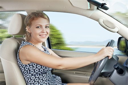 ersler (artist) - portrait of young beautiful woman sitting in the car Fotografie stock - Microstock e Abbonamento, Codice: 400-05906437