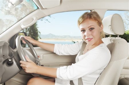 ersler (artist) - portrait of young beautiful woman sitting in the car Fotografie stock - Microstock e Abbonamento, Codice: 400-05906454