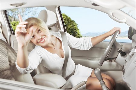 ersler (artist) - portrait of young beautiful woman sitting in the car Fotografie stock - Microstock e Abbonamento, Codice: 400-05906460