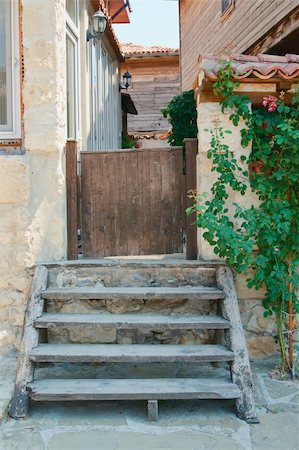 plants bulletin board - A staircase leads to the old gate into the yard. Nessebar. Bulgaria. Stock Photo - Budget Royalty-Free & Subscription, Code: 400-05906538