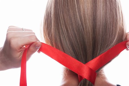 Young woman braids her hair with red ribbon Stock Photo - Budget Royalty-Free & Subscription, Code: 400-05907069