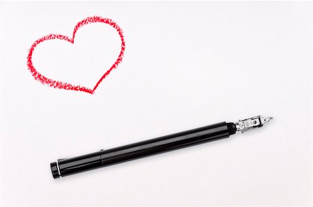 Red crayon heart and ink pen on white paper Foto de stock - Super Valor sin royalties y Suscripción, Código: 400-05907062