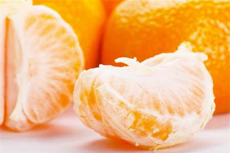 simsearch:400-08814206,k - Closeup view of a slice of tangerine Photographie de stock - Aubaine LD & Abonnement, Code: 400-05907099
