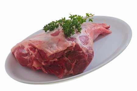 simsearch:825-03627005,k - Raw leg of lamb with thyme on a white dish Stockbilder - Microstock & Abonnement, Bildnummer: 400-05907273