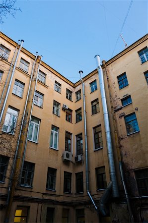 Old apartments closed yard with tubes on walls Stock Photo - Budget Royalty-Free & Subscription, Code: 400-05907321