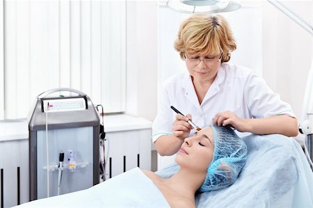 skin treatment medical - Mature beautician at work Stock Photo - Budget Royalty-Free & Subscription, Code: 400-05907478