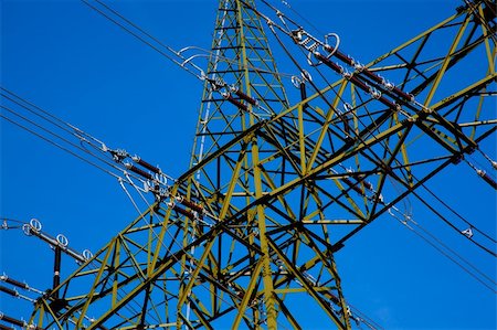 pylon in city - Electricity pylon for the transport from high voltage Stock Photo - Budget Royalty-Free & Subscription, Code: 400-05907673