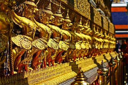The statues of Krut battling naga serpent, a Thai Buddhist adaptation of Garuda in Wat Phra Kaeo temple, Bangkok Stock Photo - Budget Royalty-Free & Subscription, Code: 400-05907680