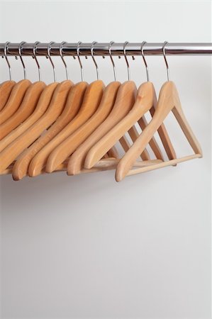 Photo of empty wooden clothes hangers in a retail store. Stock Photo - Budget Royalty-Free & Subscription, Code: 400-05907797