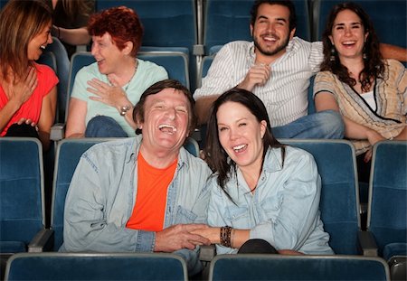 simsearch:400-06138368,k - Groups of friends in the audience laugh and smile Stock Photo - Budget Royalty-Free & Subscription, Code: 400-05907920