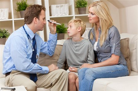 A male doctor examining a sick boy child with his mother during a home visit Stock Photo - Budget Royalty-Free & Subscription, Code: 400-05907935