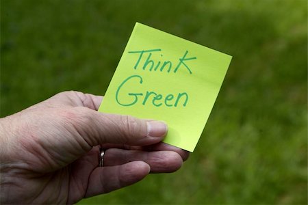 Green Eco Innovation sustainability concept: Person holding green sticky note with Think Green written on it Foto de stock - Super Valor sin royalties y Suscripción, Código: 400-05908514