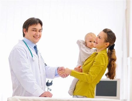 Mother thanking pediatrician doctor for baby examination Stock Photo - Budget Royalty-Free & Subscription, Code: 400-05908544