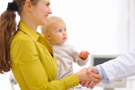 Closeup on mother with baby thanking pediatrician doctor for examination Stock Photo - Budget Royalty-Free & Subscription, Code: 400-05908549